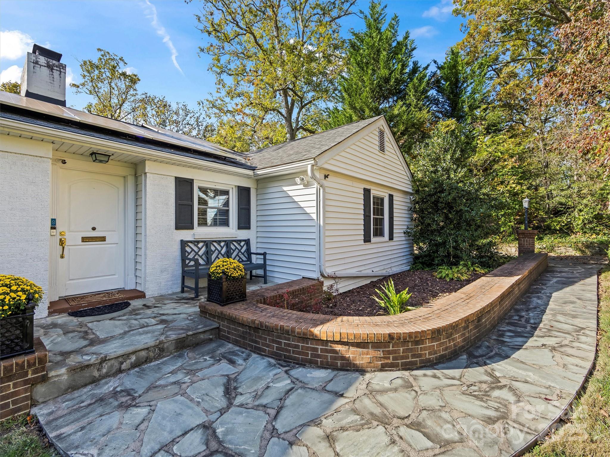9 Hilltop Road Asheville, NC 28803 - Photo 2 of 34 a view of a couches in the patio