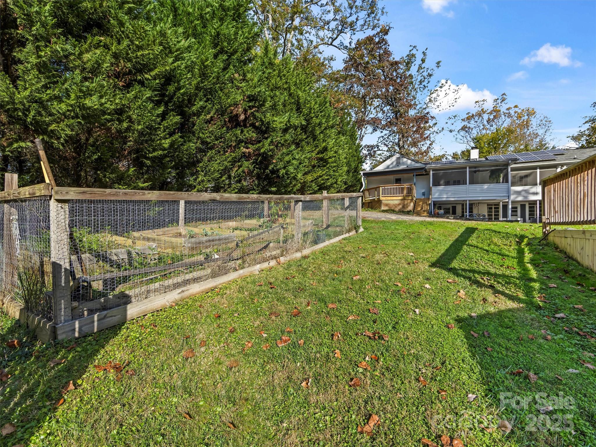 9 Hilltop Road Asheville, NC 28803 - Photo 33 of 34 a view of a house with backyard and sitting area