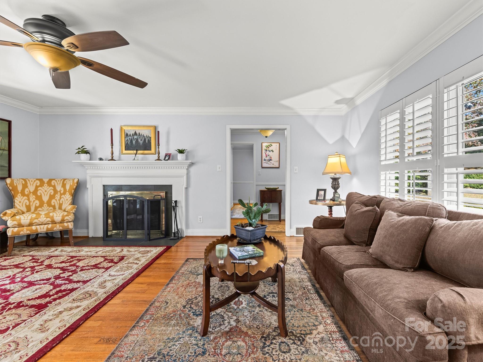 9 Hilltop Road Asheville, NC 28803 - Photo 7 of 34 a living room with furniture and a fireplace
