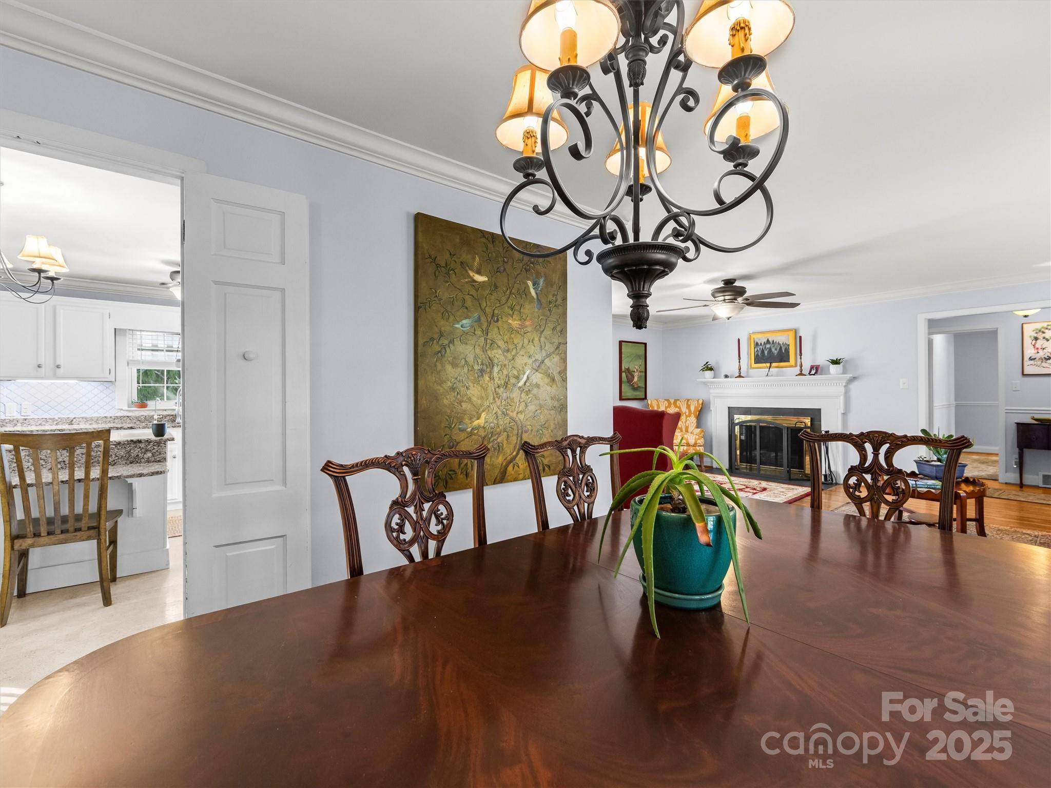 9 Hilltop Road Asheville, NC 28803 - Photo 9 of 34 a view of a dining room with furniture wooden floor and chandelier