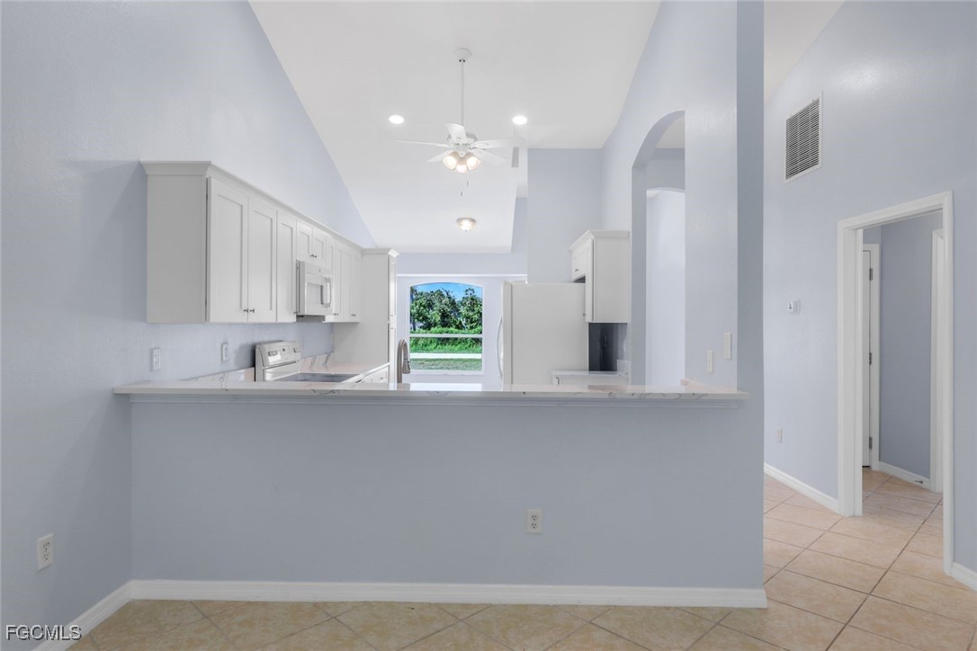5781-5783 Marina Road Bokeelia, FL 33922 - Photo 13 of 48 a view of a kitchen with a sink