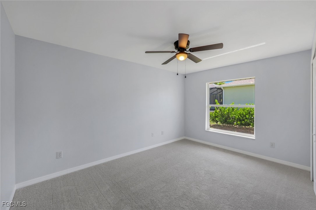 5781-5783 Marina Road Bokeelia, FL 33922 - Photo 40 of 48 a view of room with window and ceiling fan