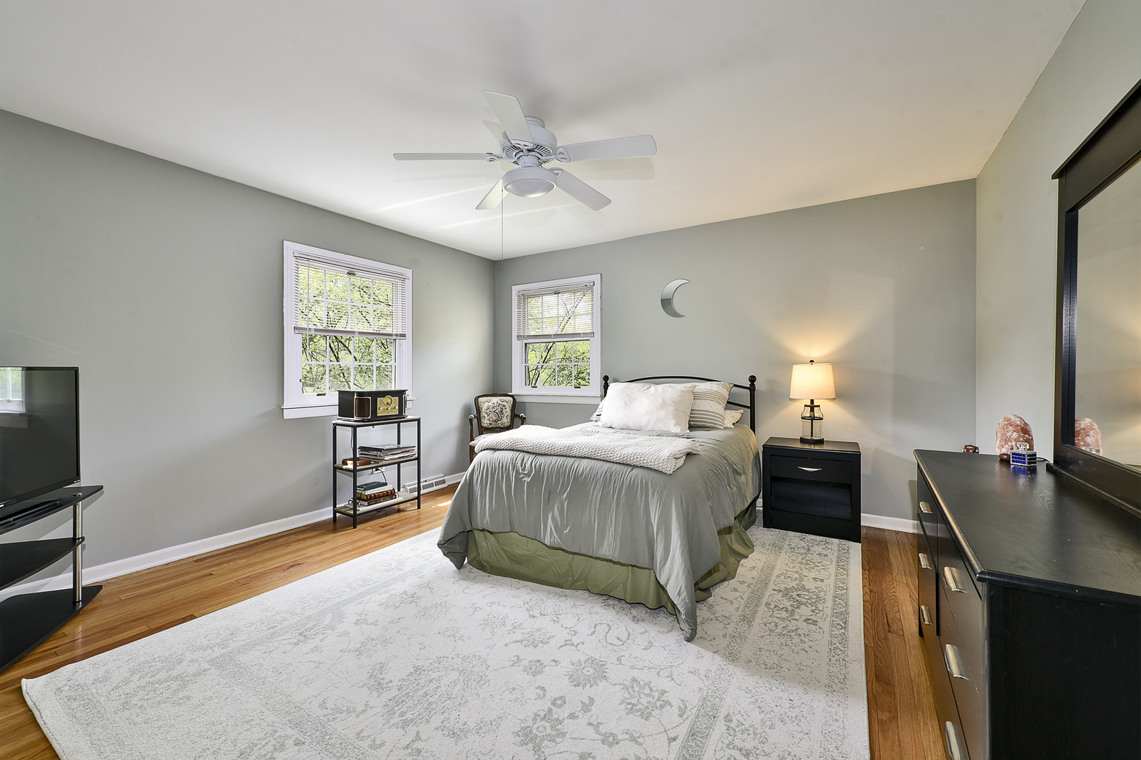 1550 Banbury Road Inverness, IL 60067 - Photo 15 of 32 a spacious bedroom with a bed and a flat screen television