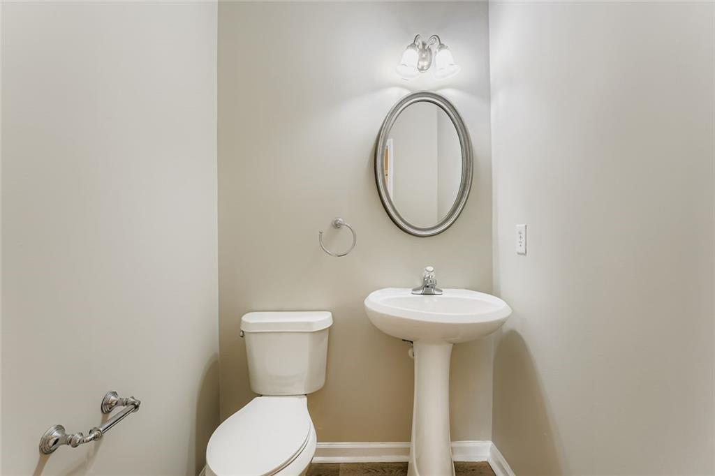 104 Oleander Way Canton, GA 30114 - Photo 15 of 28 a bathroom with a toilet sink and mirror