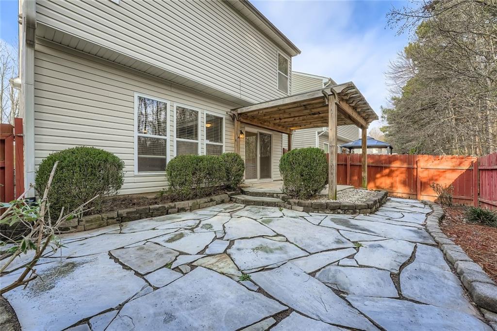 104 Oleander Way Canton, GA 30114 - Photo 28 of 28 a front view of a house with garden