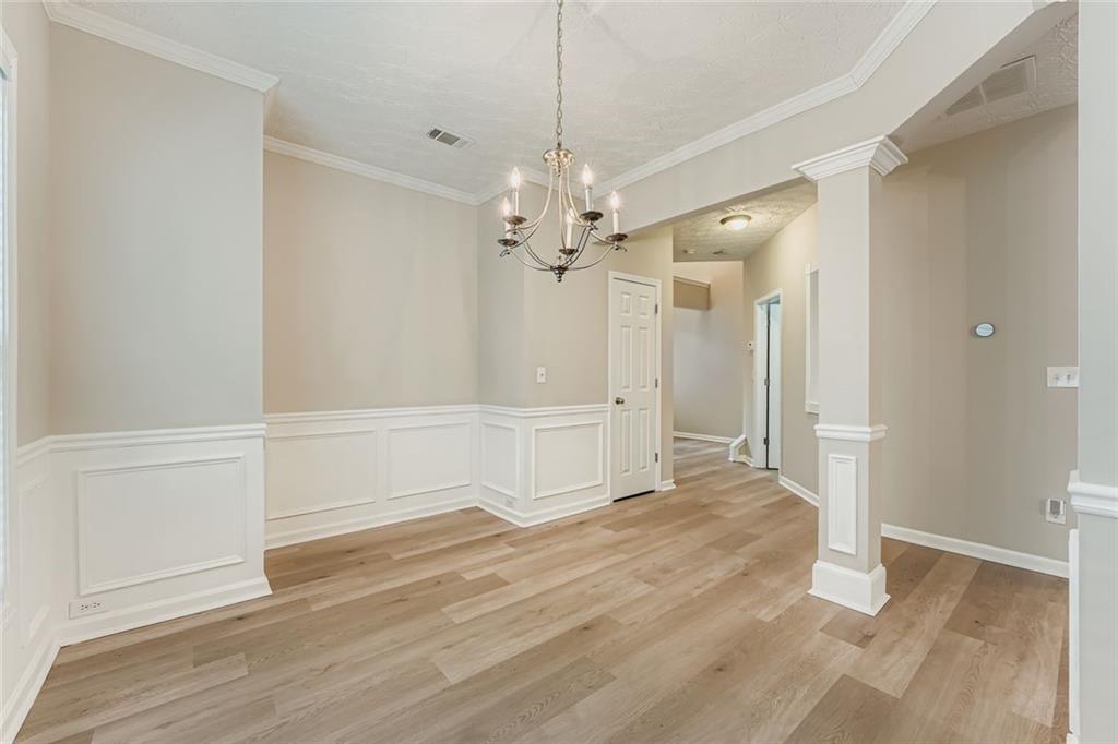 104 Oleander Way Canton, GA 30114 - Photo 10 of 28 wooden floor in an empty room with a window