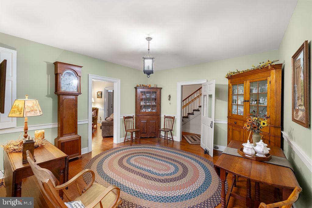 503 Main Street York Springs, PA 17372 - Photo 19 of 62 a living room with furniture a fireplace and a chandelier