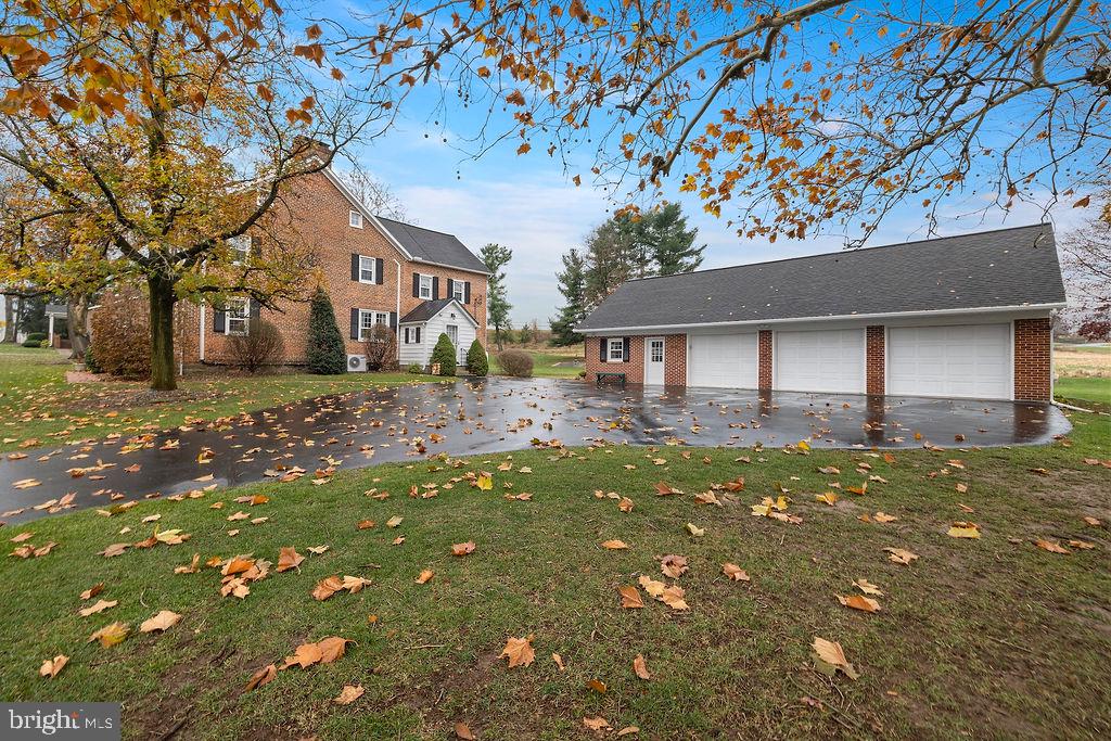 503 Main Street York Springs, PA 17372 - Photo 2 of 62 a backyard of a house with large trees and brick walls