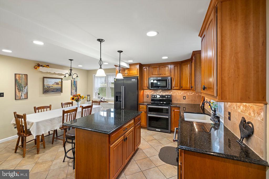 503 Main Street York Springs, PA 17372 - Photo 30 of 62 a kitchen with stainless steel appliances granite countertop a sink stove and refrigerator