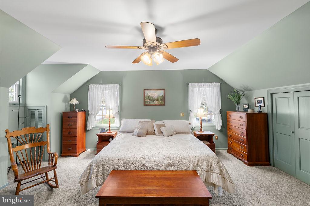 503 Main Street York Springs, PA 17372 - Photo 36 of 62 a bedroom with a bed and a chandelier