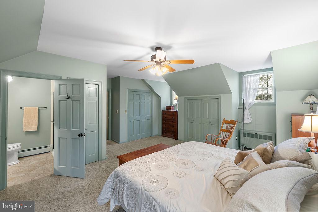 503 Main Street York Springs, PA 17372 - Photo 37 of 62 a bedroom with a bed and a chandelier