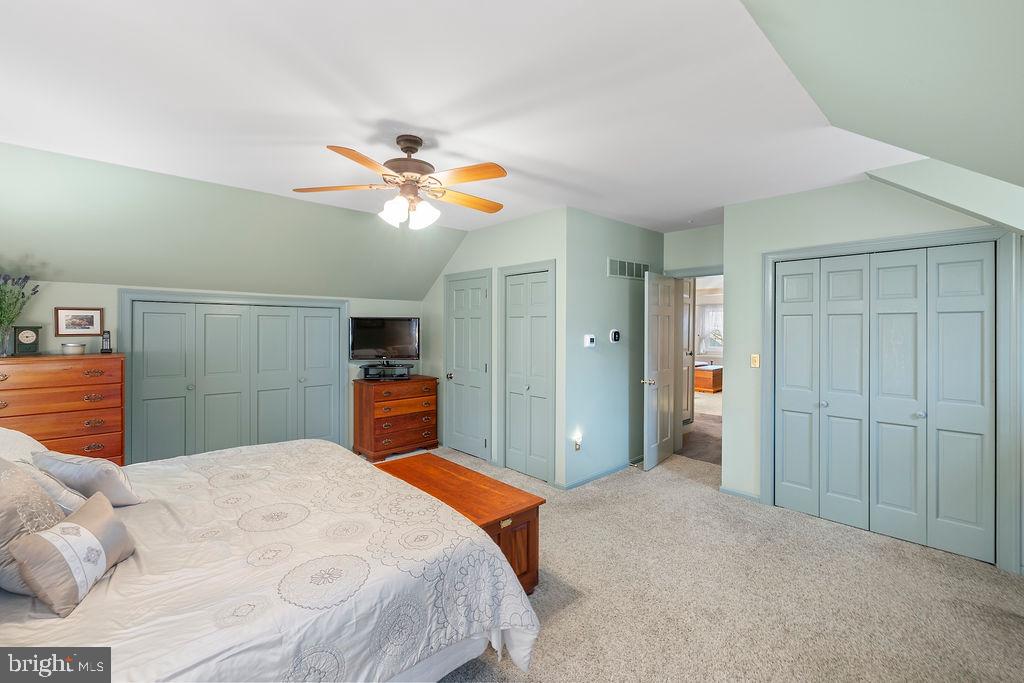 503 Main Street York Springs, PA 17372 - Photo 39 of 62 a bedroom with a bed and a chandelier