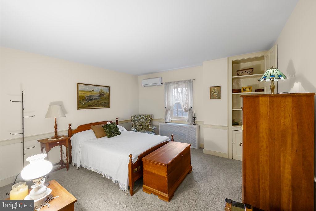 503 Main Street York Springs, PA 17372 - Photo 43 of 62 a bedroom with a bed and a table in it