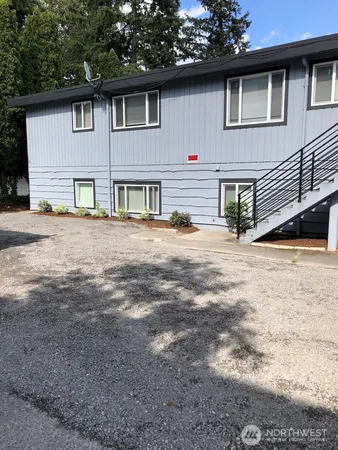 a front view of a house with yard