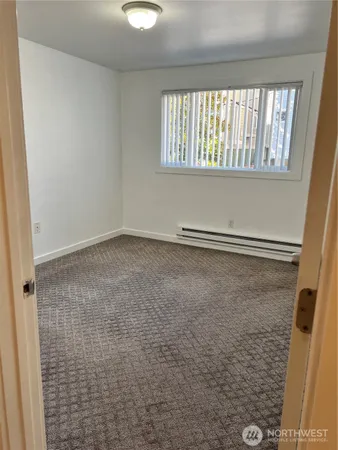 a view of an empty room with a window