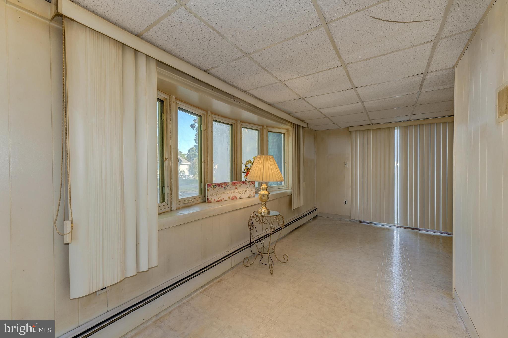 402 Line Street Hammonton, NJ 08037 - Photo 4 of 24 Sunroom with slider to side fenced yard