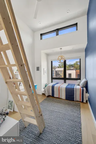 a bedroom with a large bed and a couch