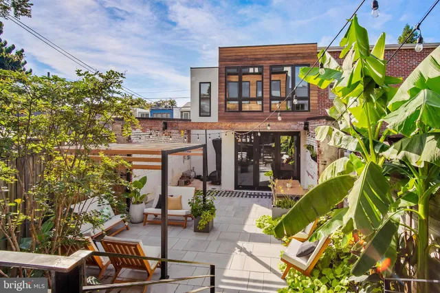 a view of a chairs and table in a patio