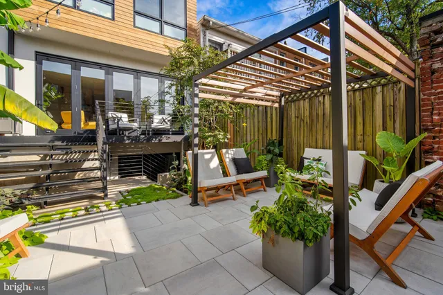 a view of a chairs and table in a patio