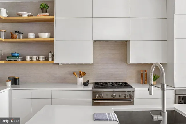 a kitchen with cabinets and appliances