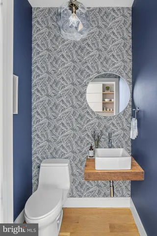 a bathroom with a toilet and a sink