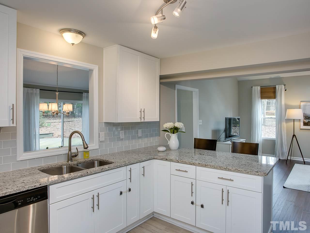 5114 Raintree Road Durham, NC 27712 - Photo 14 of 30 a kitchen with sink and window