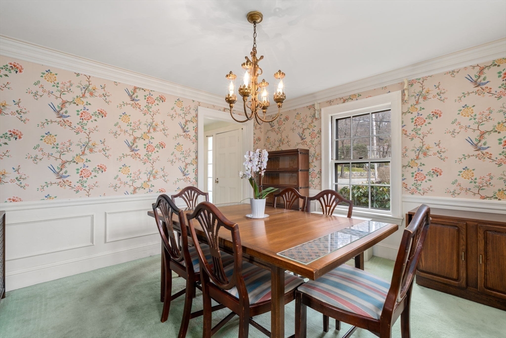 22 Arden Road Newton, MA 02460 - Photo 11 of 28 a dining room with furniture a chandelier and window