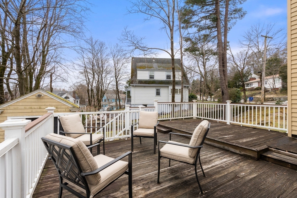 22 Arden Road Newton, MA 02460 - Photo 16 of 28 a view of a chair and tables on the roof deck