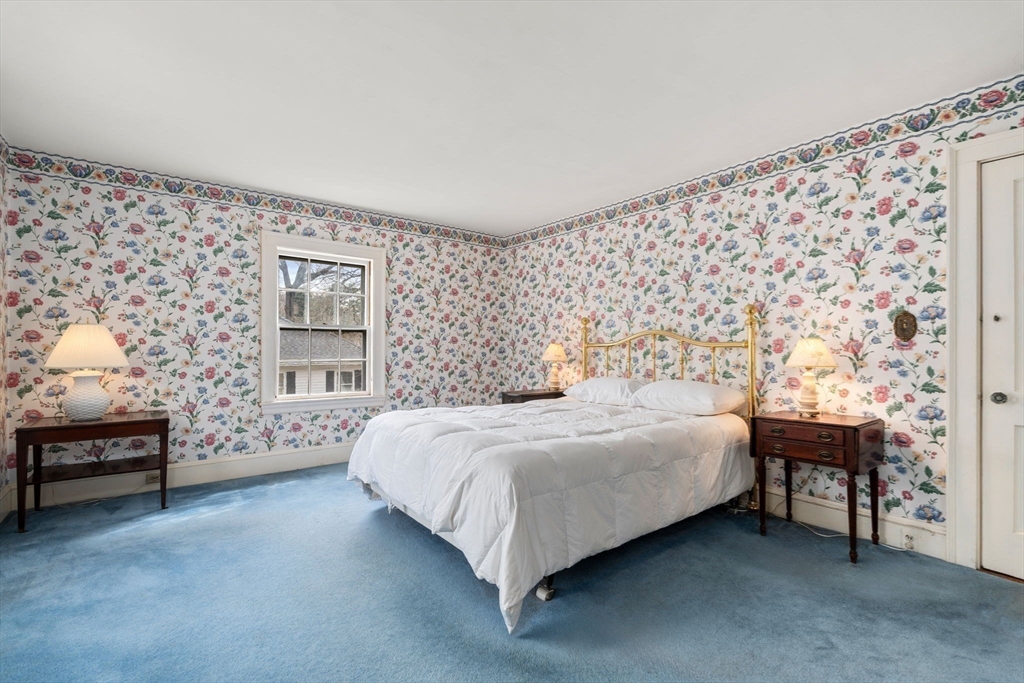 22 Arden Road Newton, MA 02460 - Photo 19 of 28 a bedroom with a bed chair and a window