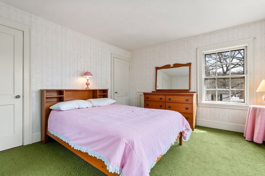 22 Arden Road Newton, MA 02460 - Photo 20 of 28 a bedroom with a bed and a window