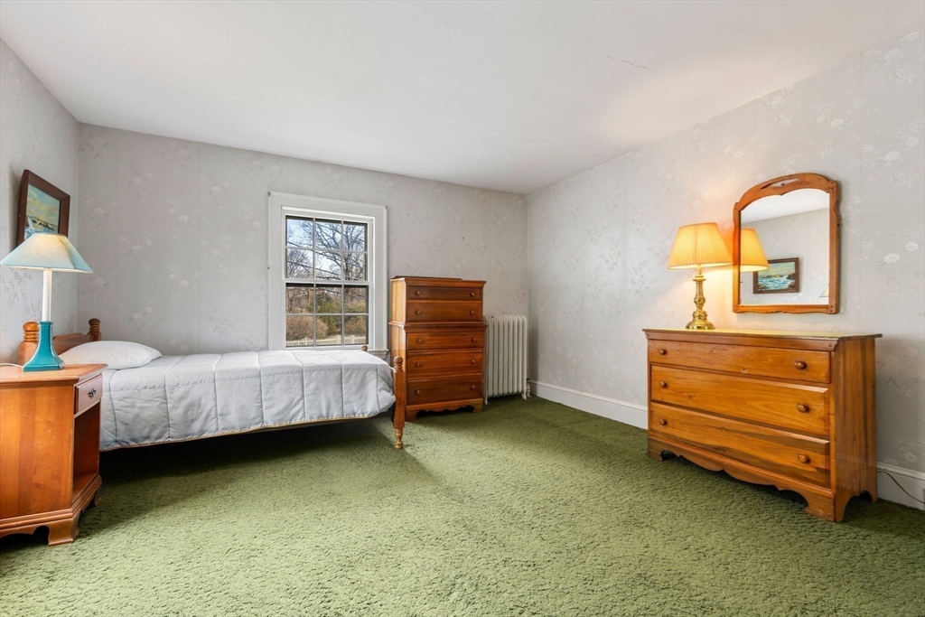 22 Arden Road Newton, MA 02460 - Photo 21 of 28 a bedroom with a bed and a dresser