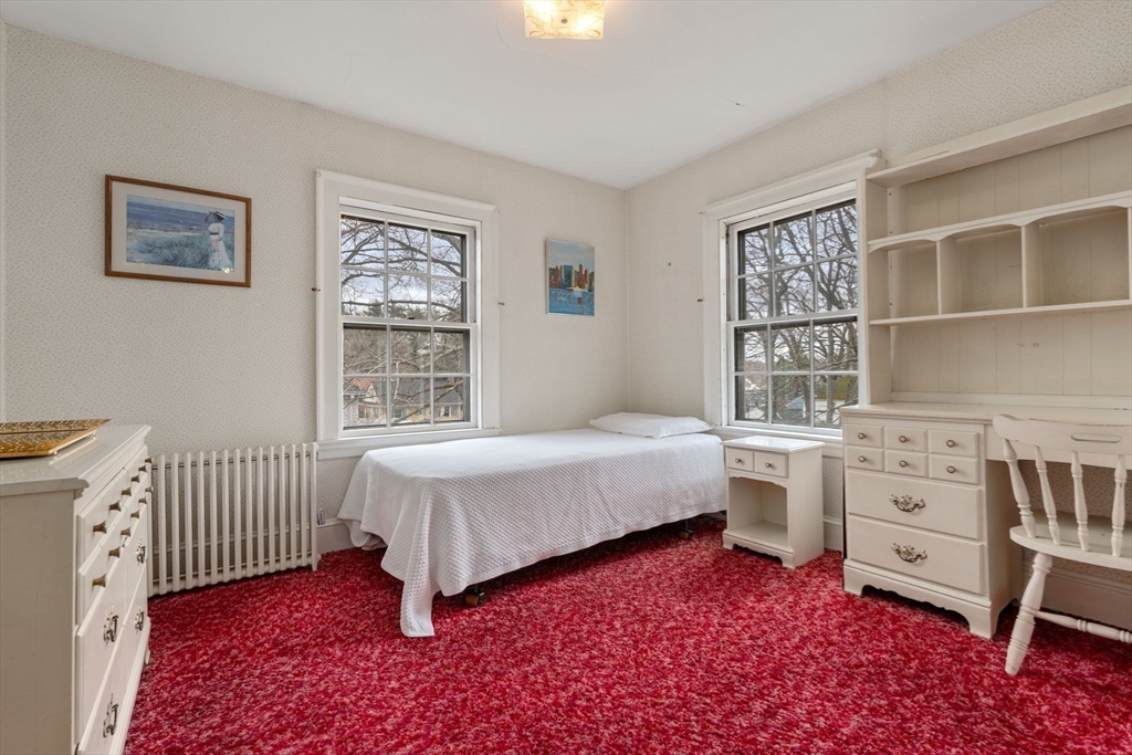 22 Arden Road Newton, MA 02460 - Photo 22 of 28 a bedroom with a bed and a window