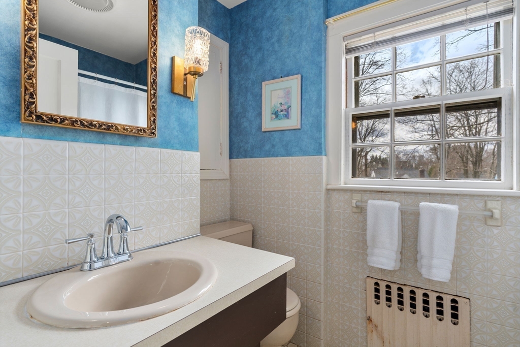 22 Arden Road Newton, MA 02460 - Photo 23 of 28 a bathroom with a sink and a mirror