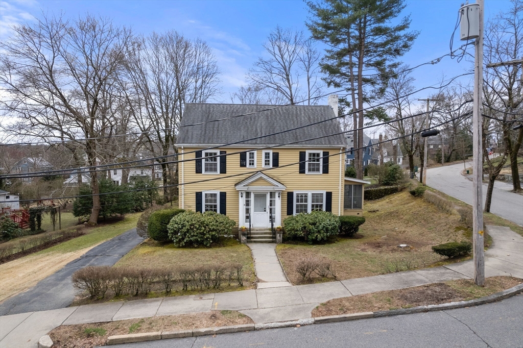 22 Arden Road Newton, MA 02460 - Photo 25 of 28 a front view of a house with a yard and garage