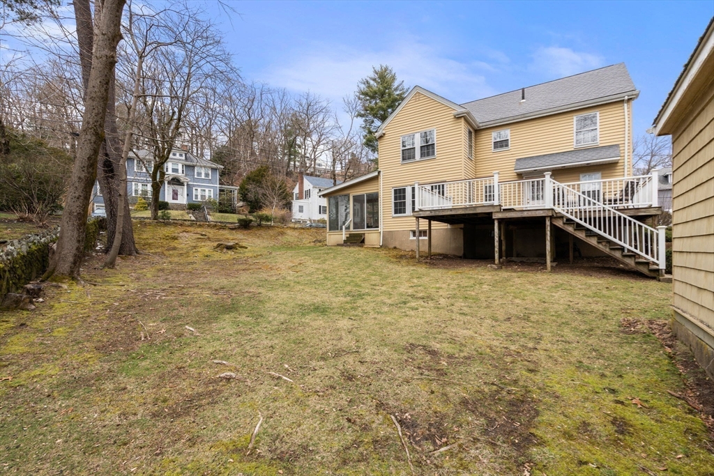 22 Arden Road Newton, MA 02460 - Photo 4 of 28 a view of a house with a large window and a yard