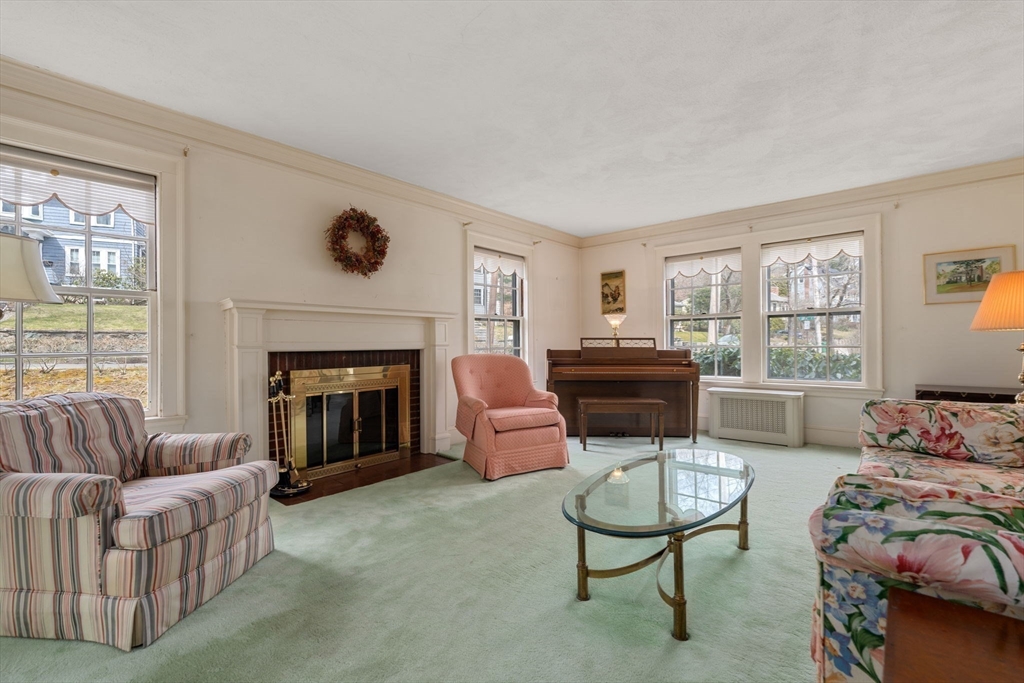 22 Arden Road Newton, MA 02460 - Photo 6 of 28 a living room with furniture a window and a fireplace