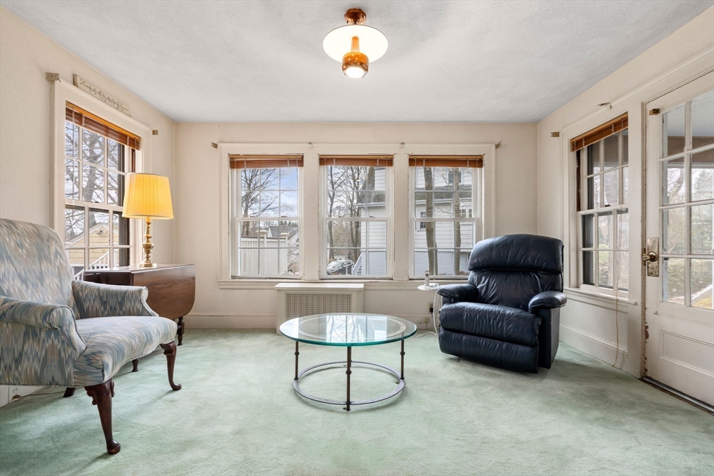 22 Arden Road Newton, MA 02460 - Photo 8 of 28 a living room with furniture and a large window