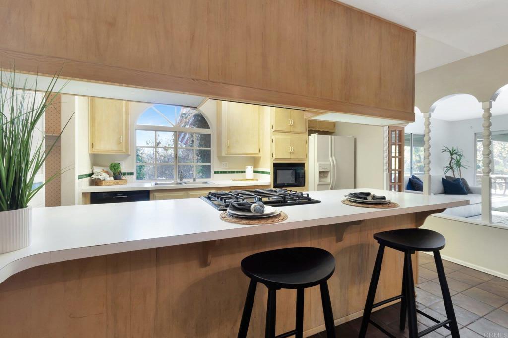 1807 Grove Road El Cajon, CA 92020 - Photo 1 of 1 a kitchen with a table and chairs in it