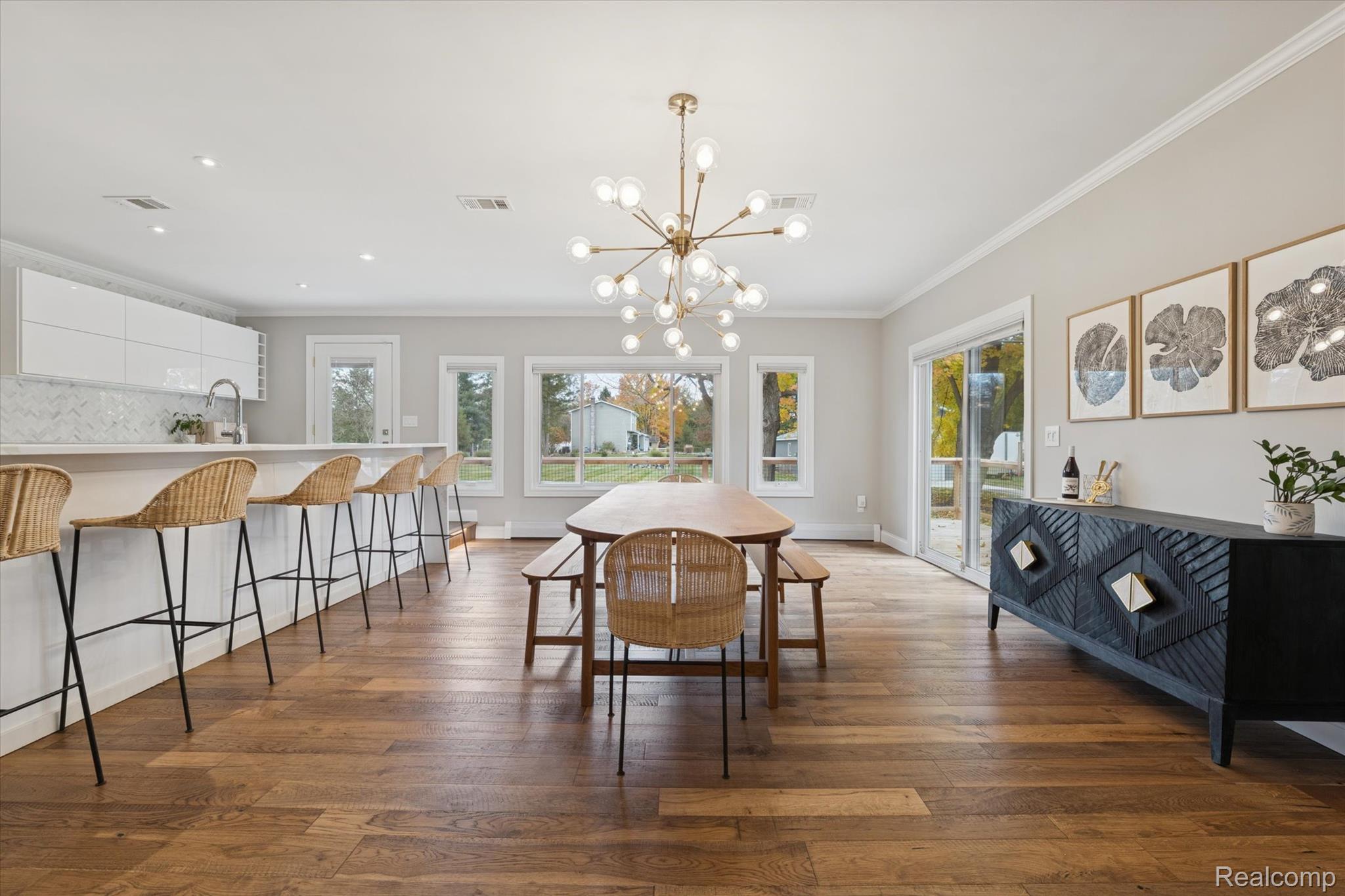 5100 Oakhill Road Clarkston, MI 48348 - Photo 16 of 54 Dining area with crown molding, plenty of natural light, a chandelier, dark wood-style floors, and recessed lighting