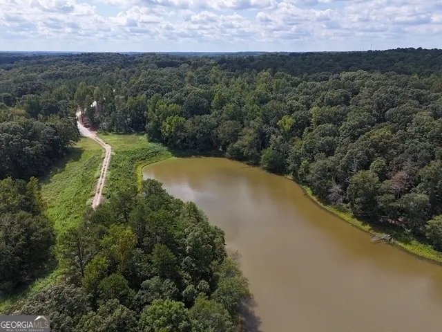 an aerial view of residential house with outdoor space