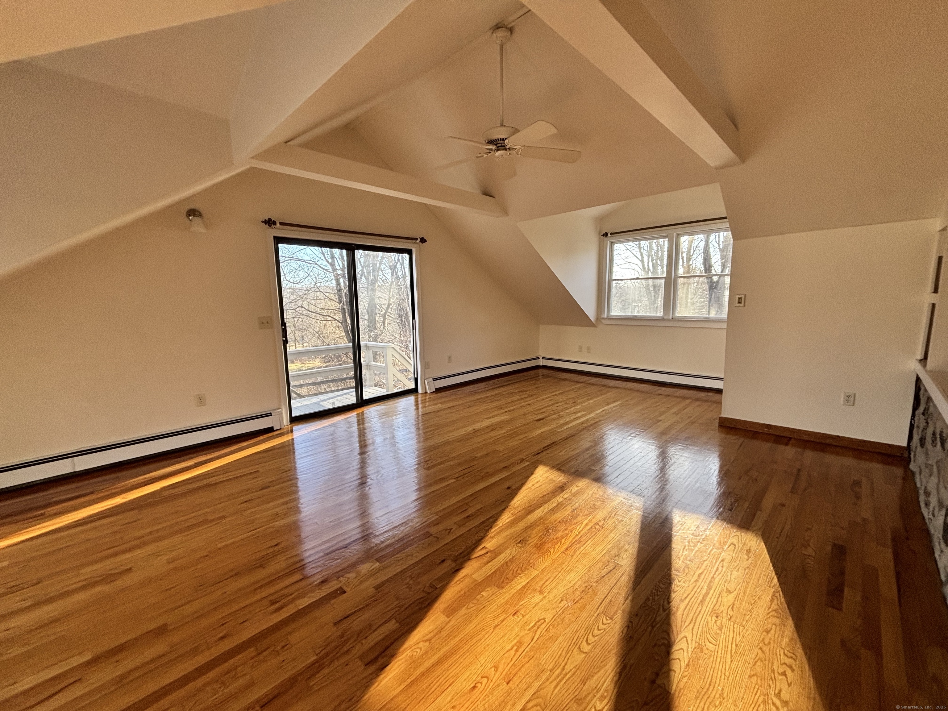 65 B Cross Highway Redding, CT 06896 - Photo 15 of 25 a view of an empty room with wooden floor and a window