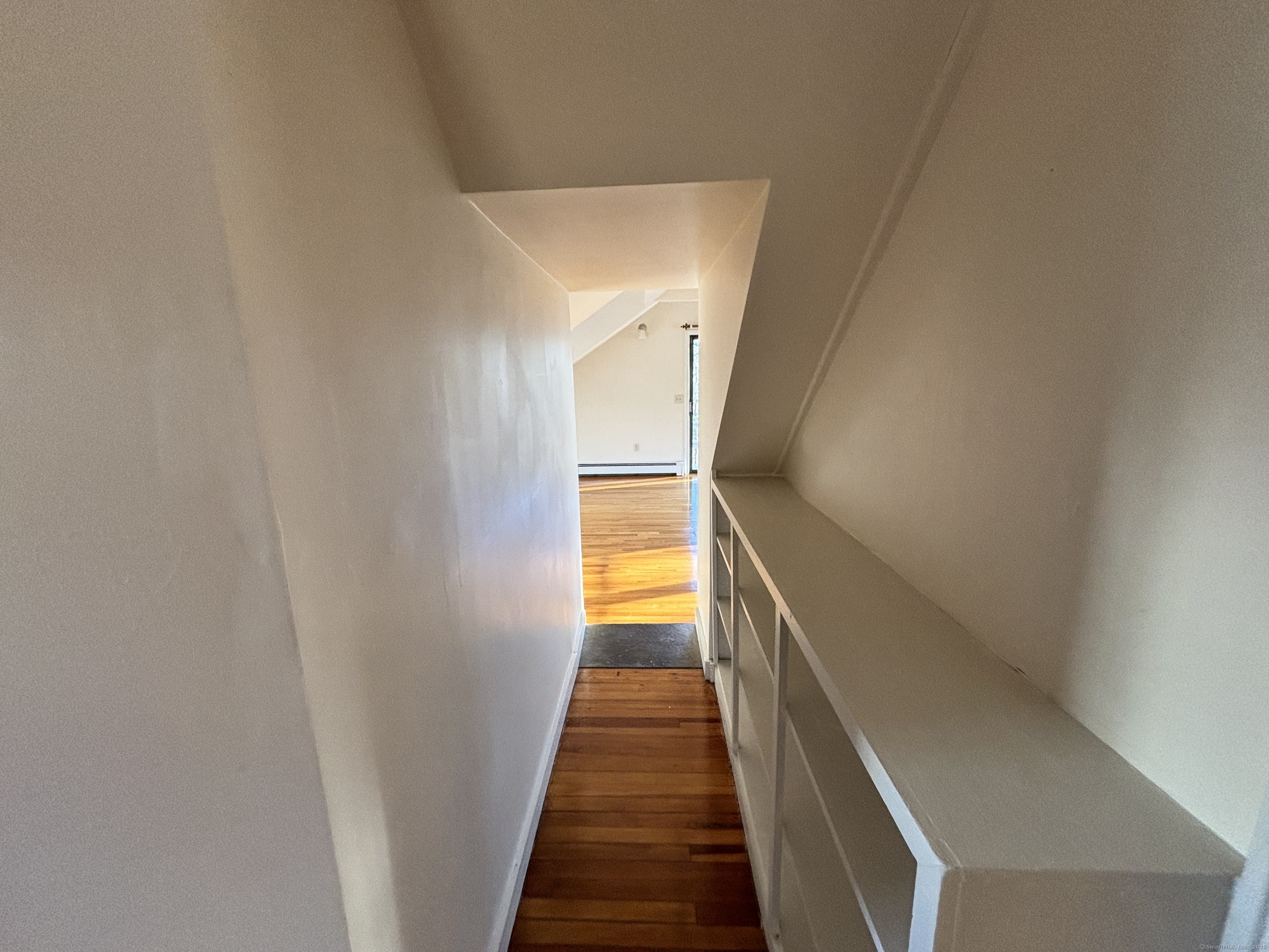 65 B Cross Highway Redding, CT 06896 - Photo 16 of 25 a view of a hallway with wooden floor and stairs