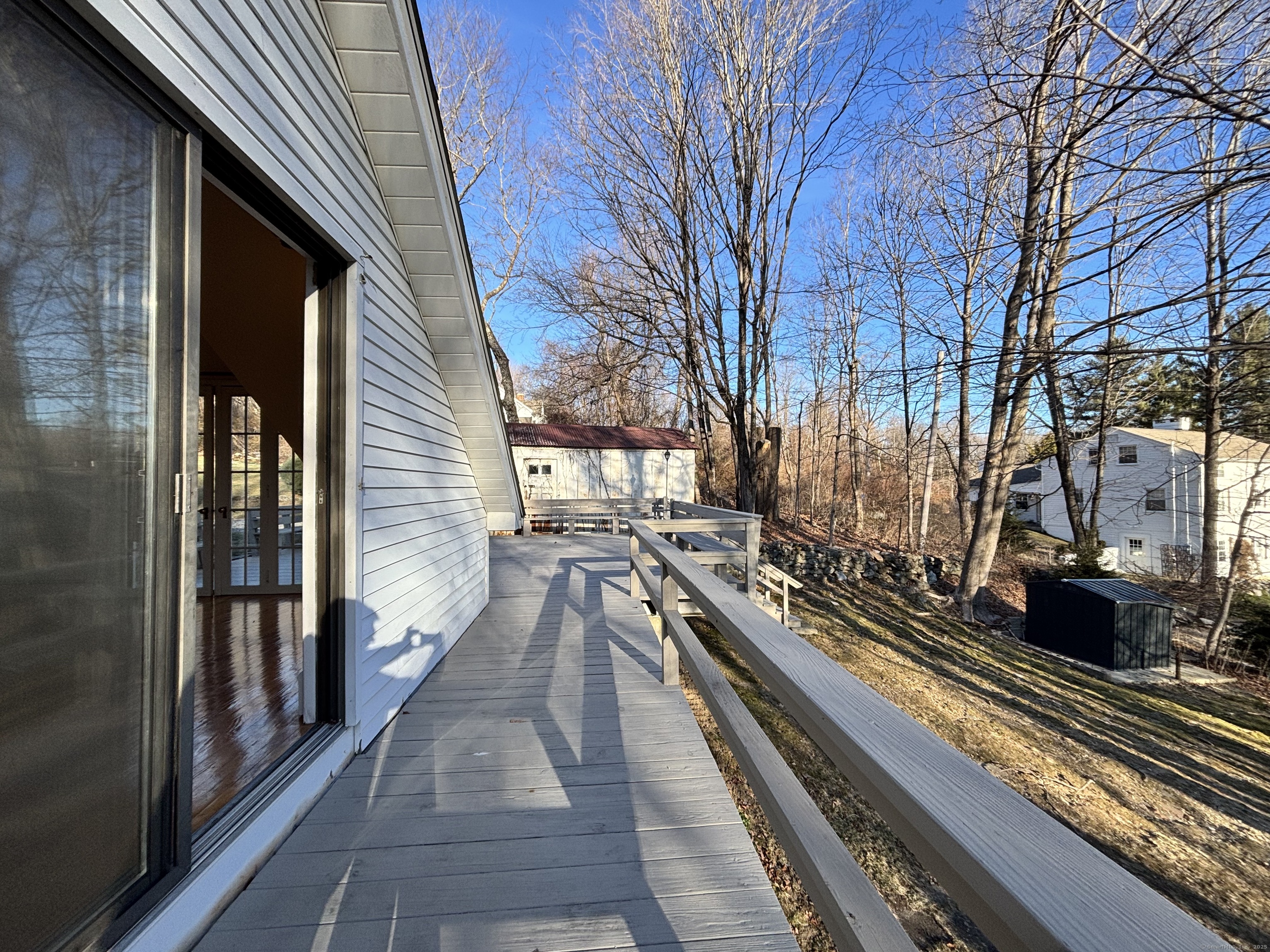 65 B Cross Highway Redding, CT 06896 - Photo 19 of 25 a view of a back yard from a balcony