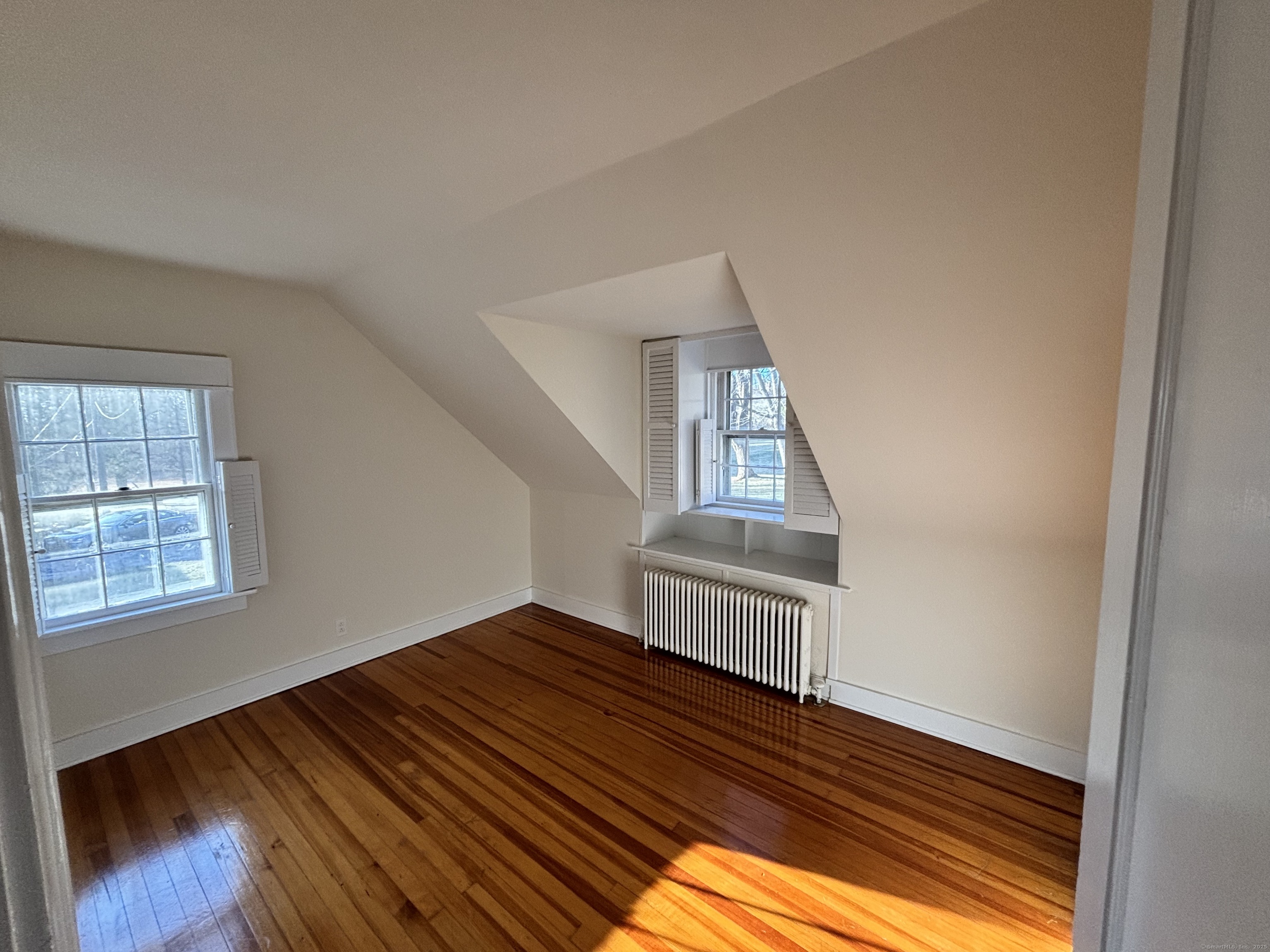 65 B Cross Highway Redding, CT 06896 - Photo 6 of 25 a view of an empty room and wooden floor