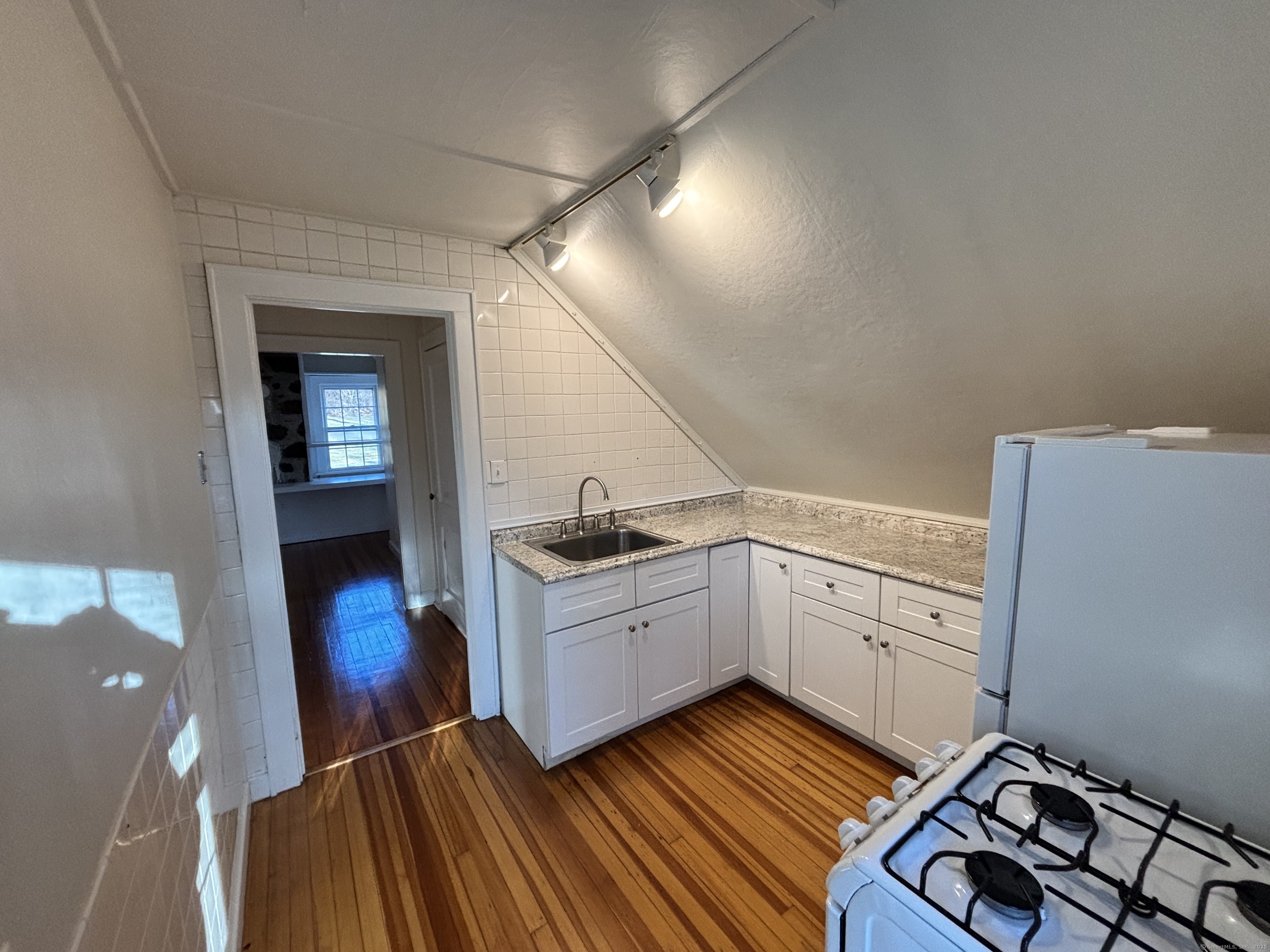 65 B Cross Highway Redding, CT 06896 - Photo 8 of 25 a kitchen with sink cabinets and stove top oven