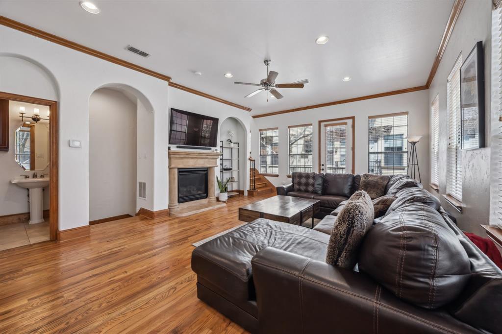 Complete with hardwood floors, a cozy fireplace, and access to a Juliet balcony.