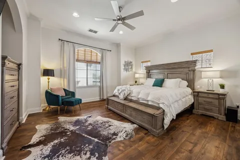 a bedroom with a bed and a couch