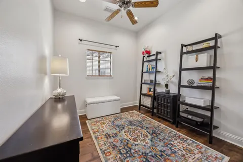 a bedroom with furniture and a window