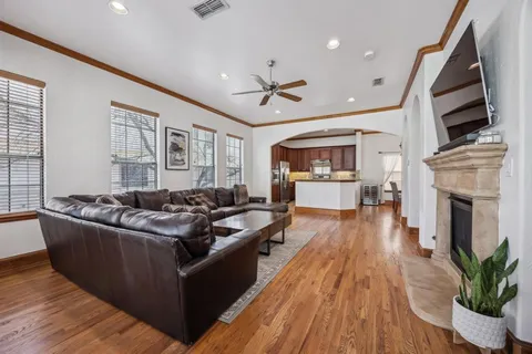a living room with furniture fireplace and flat screen tv