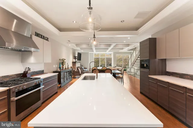 a large kitchen with stainless steel appliances